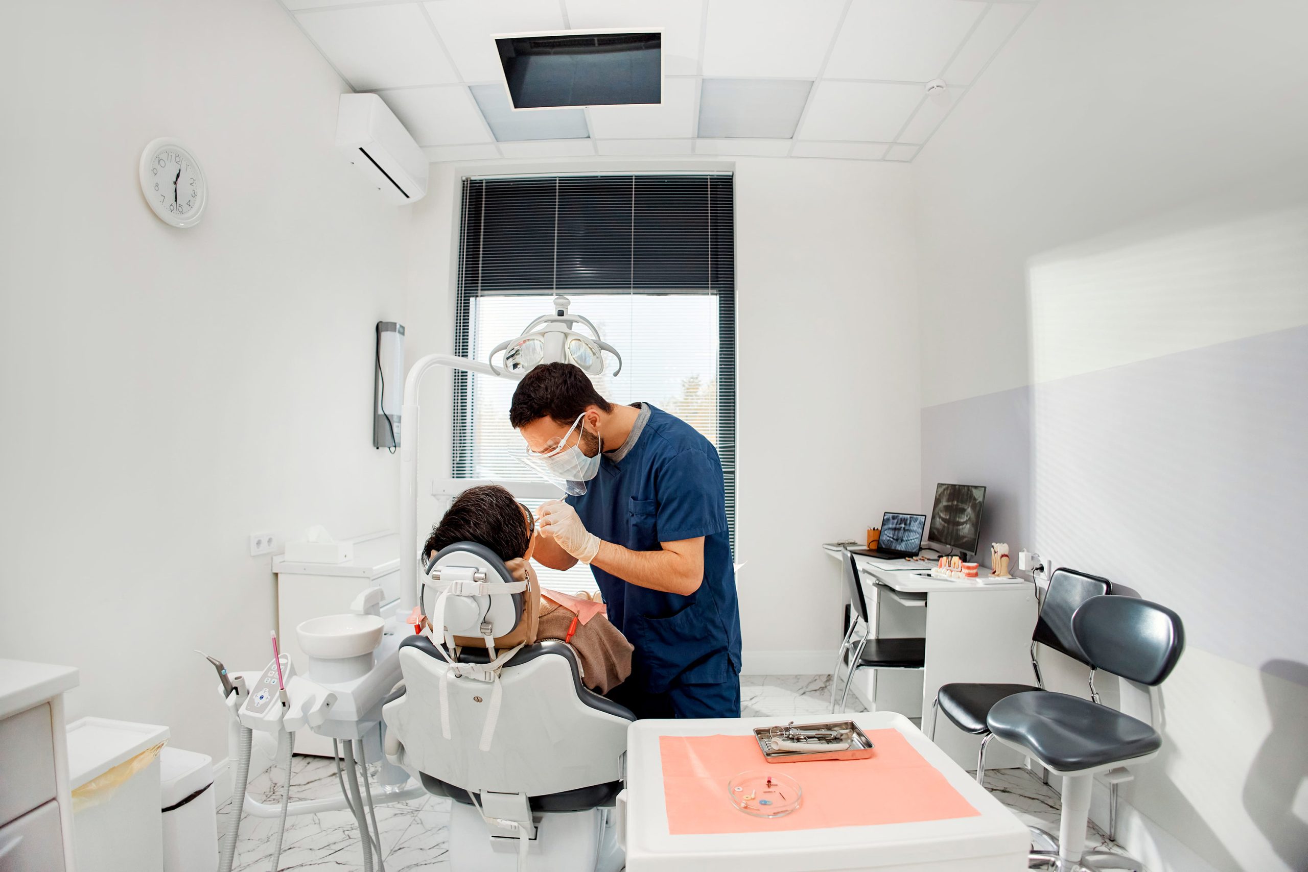 young male dentist examining female patient in den 2026 03 26 23 34 55 utc