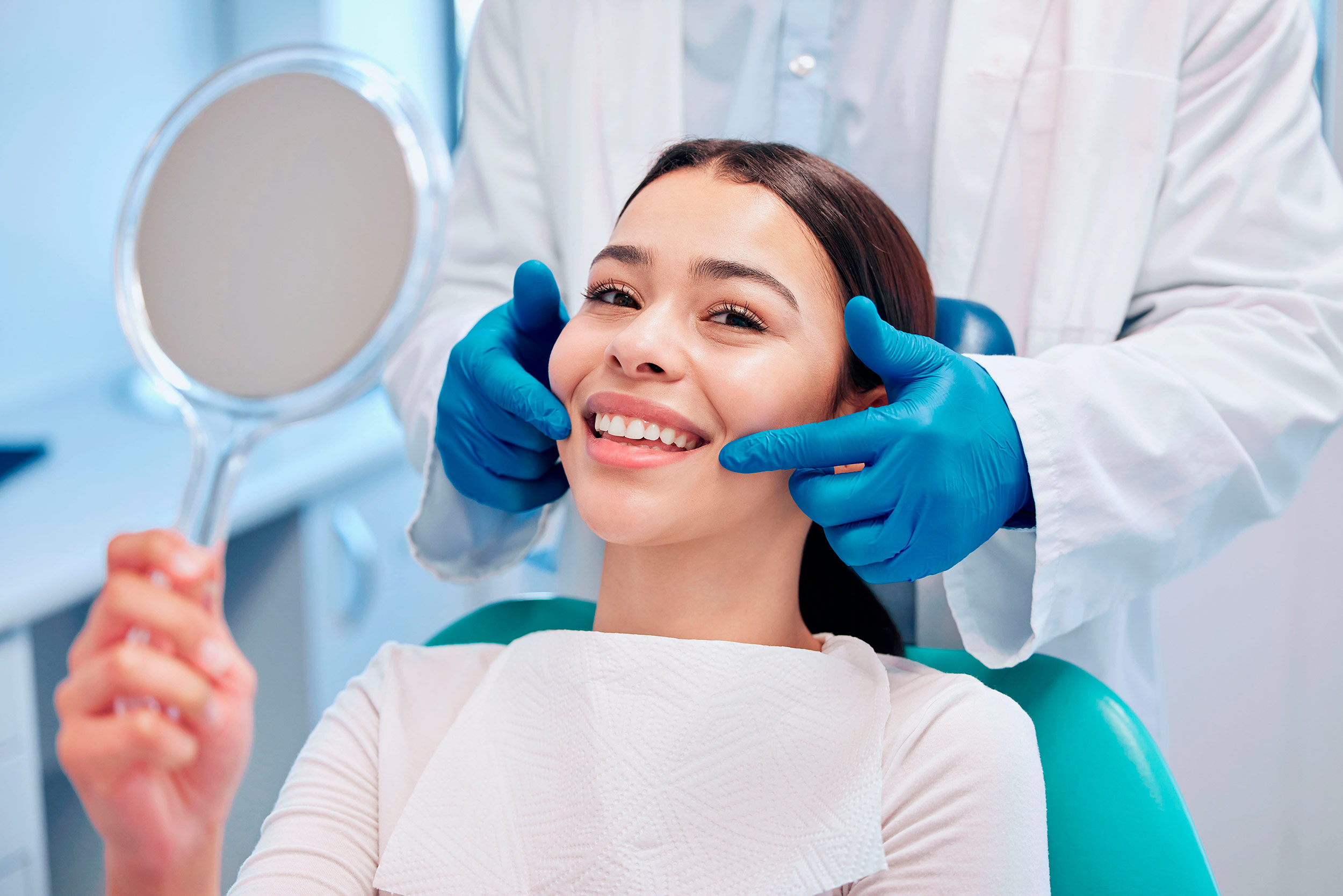 young woman smiles in dental exam chair 2026 01 09 10 44 04 utc